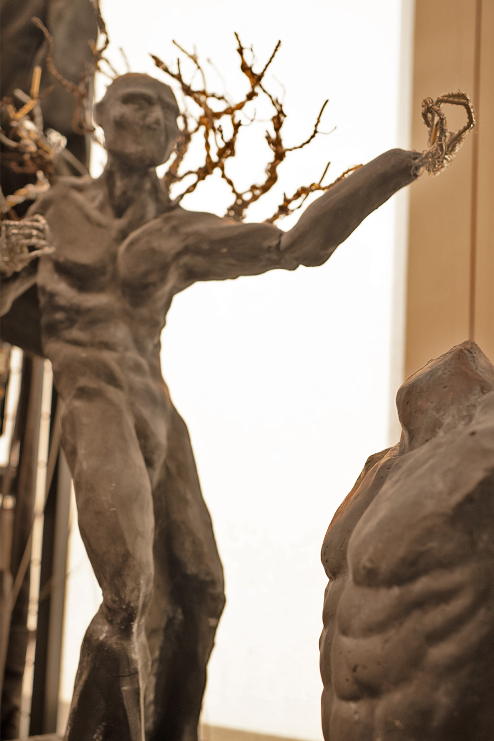 Sculpture of a figure with branching arms