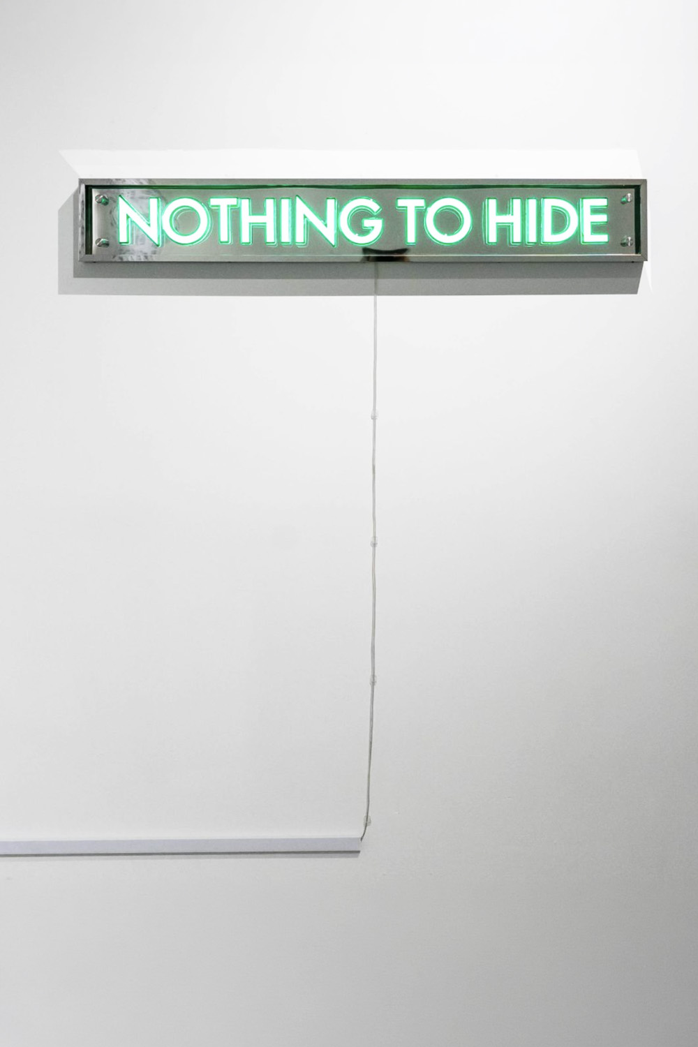 Neon sign reading Nothing to hide